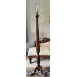 A mahogany standard lamp on tripod base with reeded and wheatsheaf decoration. 173cm h to top of