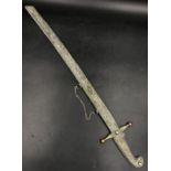 A white metal Russian dress sword and scabbard with engraved writing to reverse 74 l, blade 55cm l.