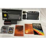 A boxed Sinclair ZX Spectrum personal computer, with three books, a ZX Spectrum 32K rampack Cheetah,
