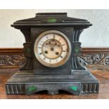 A 19thC black marble mantle clock with green marble pillars to both sides of white enamel face. 32 h