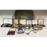 A collection of silver plate items to include a large ornate serving tray on raised feet 74.5 x