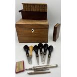 A miscellany to include a Georgian tea caddy, inlaid puzzle box, Purdey wooden box containing