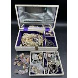 A jewellery box and contents of costume jewellery to include 925 silver, W.V.S and other badges