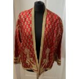 A vintage oriental jacket richly embroidered in gold thread work. Pockets to interior. Shoulder to