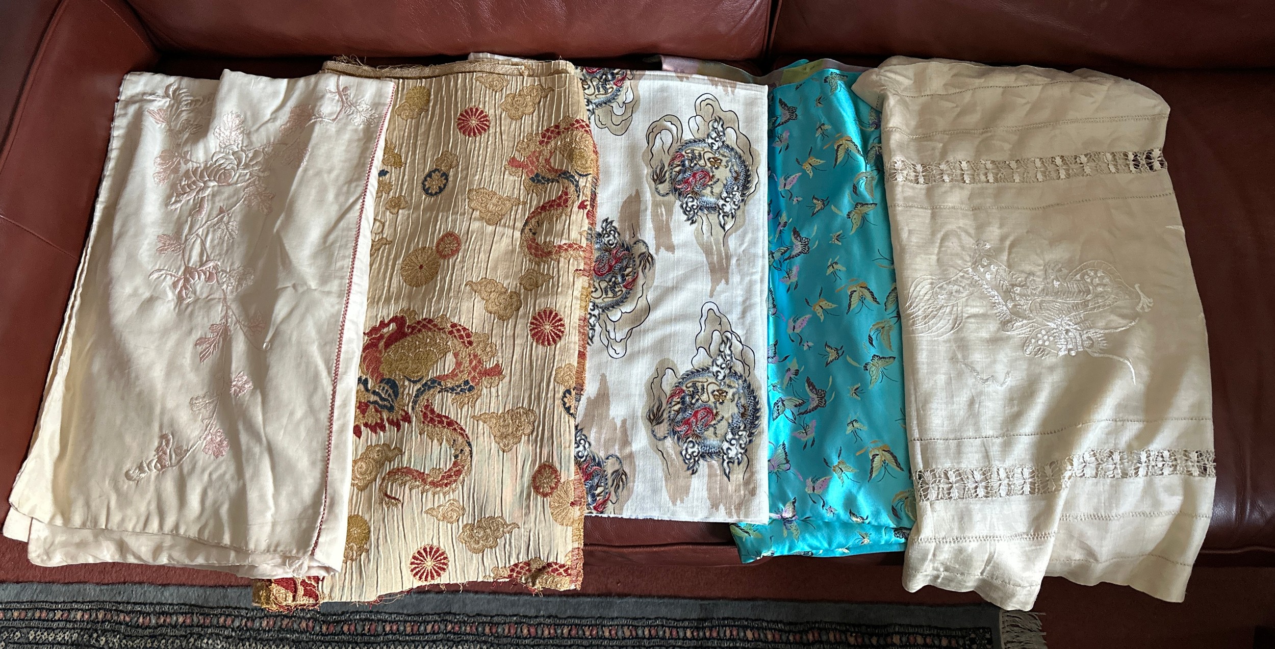 Oriental theme fabric pieces and two Chinese embroidered cloths one with drawn thread work. (5) Blue