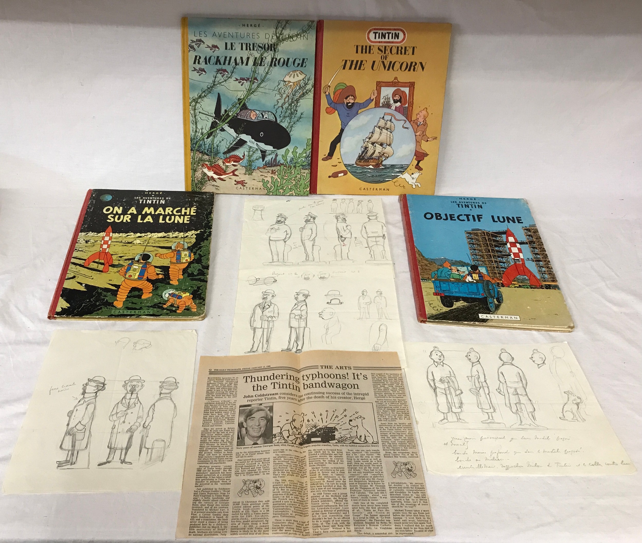 Hergé: Four original sketches by Belgium artist Hergé along with four comic books from the 40s and