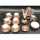 A Royal Crown Derby Imari palette 2451 pattern coffee set comprising of six coffee cups and saucers,