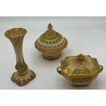 Three pieces of Royal Worcester blush ivory to include two reticulated potpourri and a vase 14cm h.