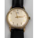 An Astral 9ct gold cased automatic wristwatch with black leather strap. Good condition, winds and