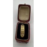 An 18 carat gold ring set with diamonds in original presentation box. Weight 2.7gm. Size O.