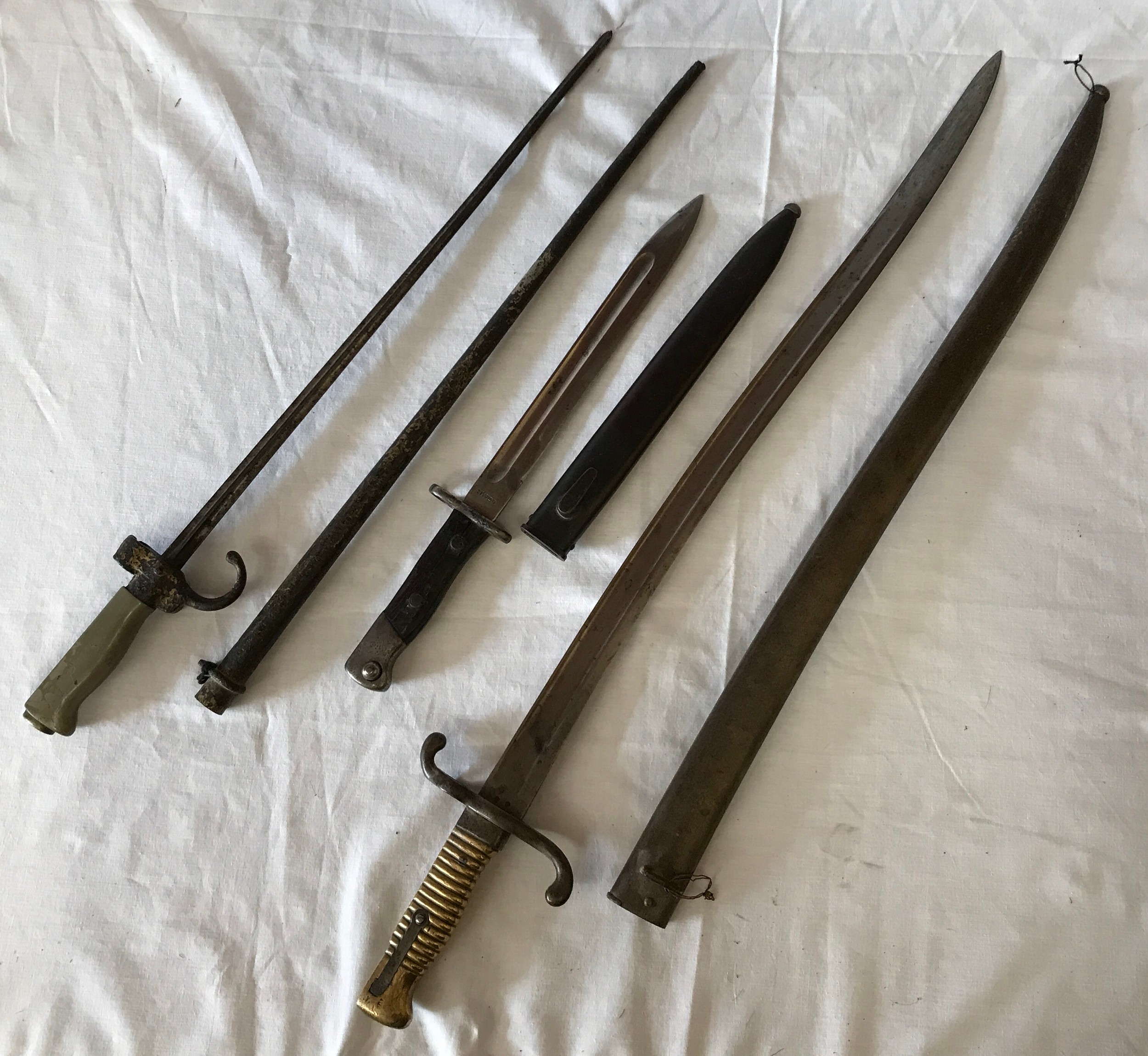 Three Bayonets to include a French Model 1867 Chassepot Yataghan Sword Bayonet and Scabbard, brass