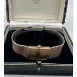 A 9ct gold Bueche Girod bracelet watch, rectangular shape, champagne dial. Case: 21mm. 18.5cm l.