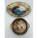 Two Noritake dishes, one with gilt and lake scene 26.5 19cm and gilt and desert scene to the other.