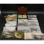 A collection of postcards and pictures of North Cave and South Cave along with a wooden box encasing