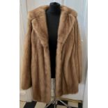 A vintage mink fur jacket, approximate size 22. Neck to hem 82cm. Underarm to underarm 67cm.