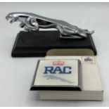 A heavy chrome Jaguar car mascot on plinth and RAC Jaguar badge.