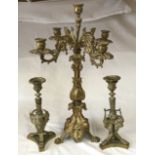 A gilt metal five branch candelabra 58cm h, along with a pair of ornate brass candle sticks