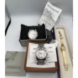 Three boxed watches to include a Bulova gentleman's quartz, a Michael Herbelin Day/Date quartz