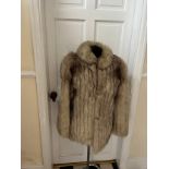 A vintage silver fox fur jacket. Nape to hem 74cm. Armpit to armpit 47cm.