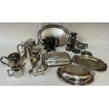 A collection of silverplate items to include 5x teapots, lidded serving dishes, trays and jug