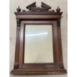 A nineteenth century decorative oak frame with carved cornice between two finials. Total size 94 x