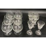 A collection of glasses to include 6x brandy glasses with etched design, 5x sherry glasses with