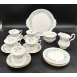 A part tea set by Richmond decorated in blue flowers to include 5x tea cups, 6x saucers, 5x side