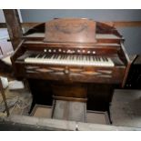 A 19thC oak American organ retailed by Turner and Phillips Plymouth, Estey organ co. Brattleboro