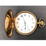 A Zenith 9ct gold hunter pocket watch marked inside 2537842 Dennison watch case co ltd. 95.3gm.