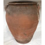 A large twin handled terracotta vase with glazed interior. 49 h x 42cm w approx.