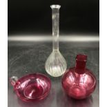 Two pieces of cranberry glass, one vase 17cm h and one shallow bowl with handle 14cm d along with