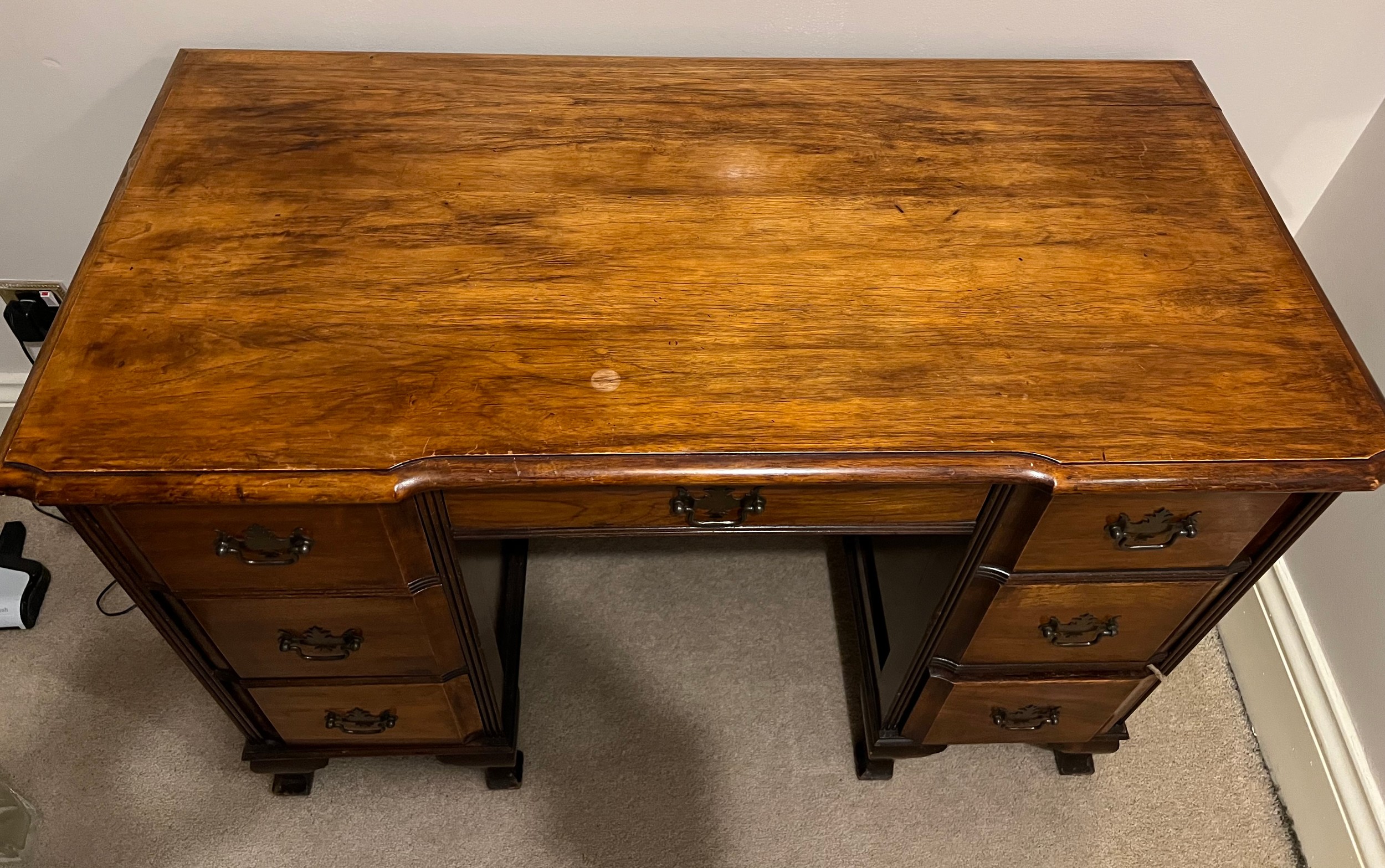 An early 20thC mahogany kneehole desk on bracket feet 73cm h x 106cm w x 53cm d. - Image 2 of 5