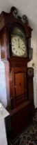 A 30 hour oak and mahogany crossbanded longcase clock with painted face and swan neck pediment. W.