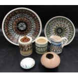 Five pieces of Brynmawr Studio pottery, circa 1965, overpainted with abstract designs, two bowls