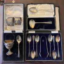 Hallmarked silver to include two napkin rings, boxed spoons and sugar tongs, egg cup and spoon