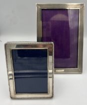 Two silver photograph frames, Birmingham 1931 and London 1993. Largest 16 x 10.5cm.