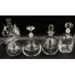 A collection of glassware to include a port sipper decanter with three glasses and three decanters