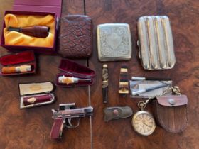 Cigar accessories, cheroot holders and accessories, to include amber, bone and silver holders etc