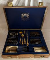 A cased set of gold plated Solingen cutlery.