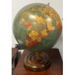 A vintage terrestrial globe on a turned wood base. Georama Ltd. 65cm h together with a three time