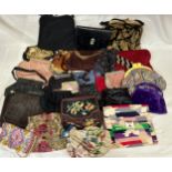 Twenty five vintage and contemporary handbags, various shapes and sizes.