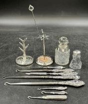 A quantity of hallmarked Silver to include 7 button hooks, a nail file, a hat pin, a ring tree, a