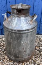 Twin handled metal churn with lid, which fits firmly, height to top of lid approx 55cm, base