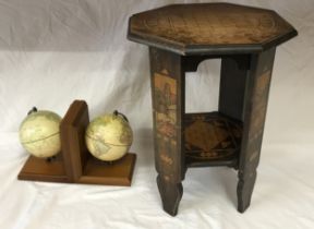 A pair of book ends with globe decoration along with a small octagonal painted table 45cm h.