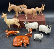 Beswick figures of animals to include 3 donkeys, 3 foxes, 3 sheep and one deer all stamped to base.