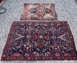 Two vintage wool rugs, largest blue and red 141 x 210cm smallest in brown tones 11 x 143cm.