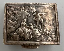 A white metal box with repoussé decoration to top and sides and gilt lining. 3 x 2cm