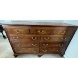 A 19thC mahogany chest of 4 drawers with 4 dummy drawers and lift up lid with brass swan neck