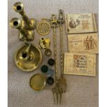 A miscellaneous lot to include a brass 18thC taperstick, brass toasting forks, John Player cigarette