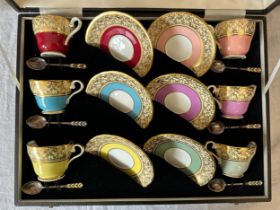 A boxed Aynsley Harlequin coffee service comprising six cups and saucers, pattern C163, together